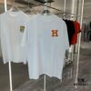 Hermes 2025 Spring-Summer New Short Sleeve T-Shirt with Hand-Customized Logo on Chest, Pure Cotton Fabric with Gold Thread Embroidery, Classic Buttoned Hem and OS Drop-Shoulder Fit