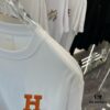 Hermes 2025 Spring-Summer New Short Sleeve T-Shirt with Hand-Customized Logo on Chest, Pure Cotton Fabric with Gold Thread Embroidery, Classic Buttoned Hem and OS Drop-Shoulder Fit