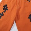 Chrome Hearts & Croc Heart Art Basel Orange Flared Jeans with Cross Design