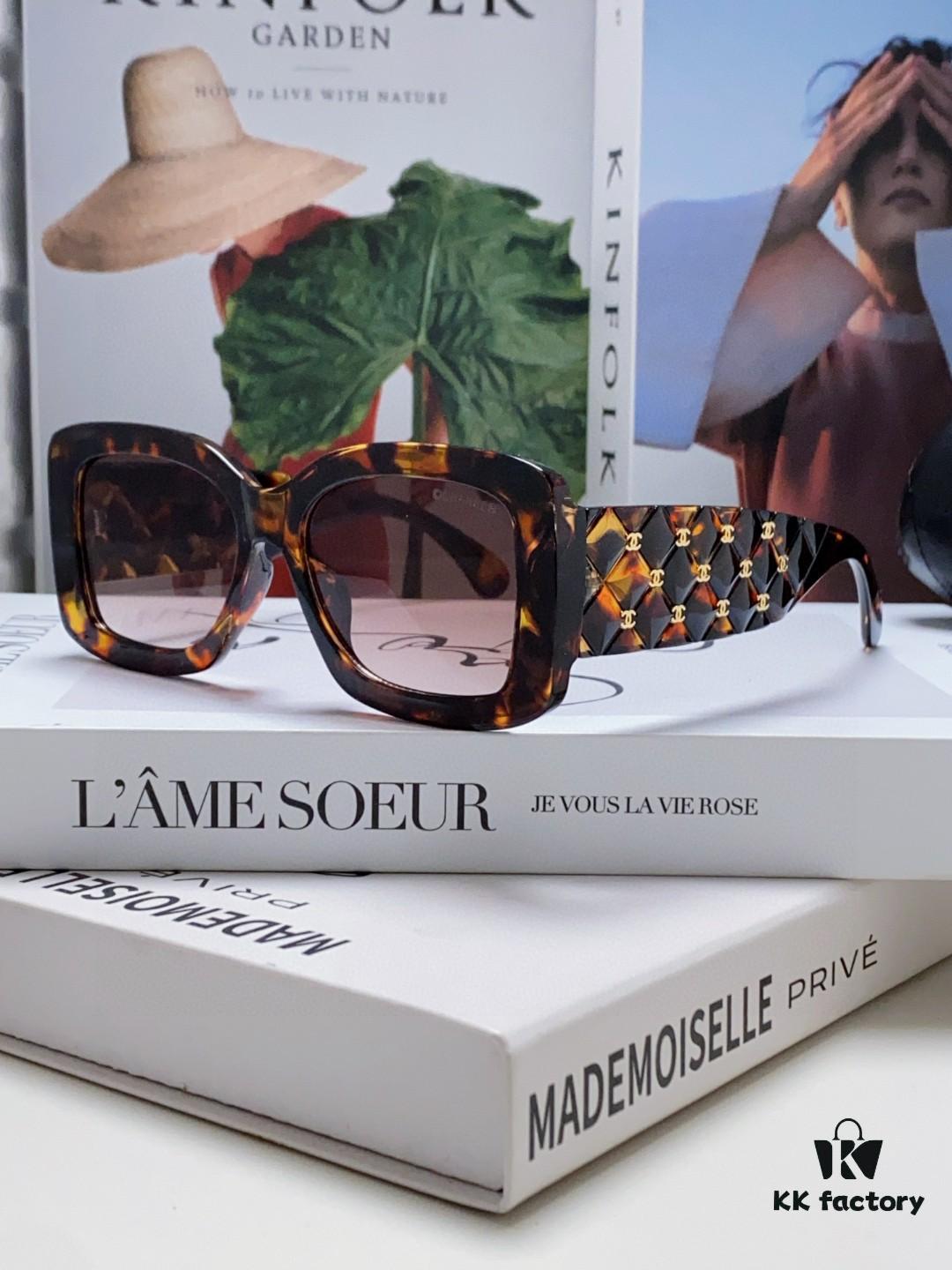 CHANEL New Classic Black and White Sunglasses with Logo-Embellished Temples