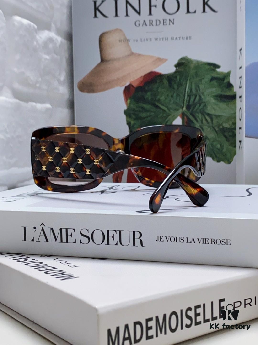 CHANEL New Classic Black and White Sunglasses with Logo-Embellished Temples