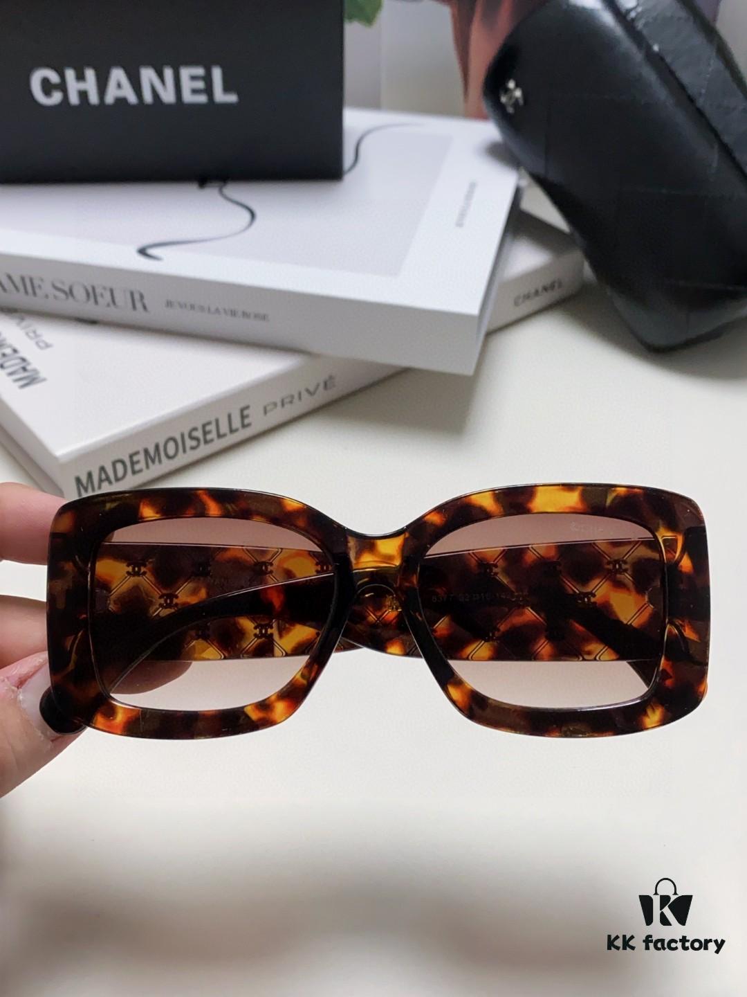 CHANEL New Classic Black and White Sunglasses with Logo-Embellished Temples