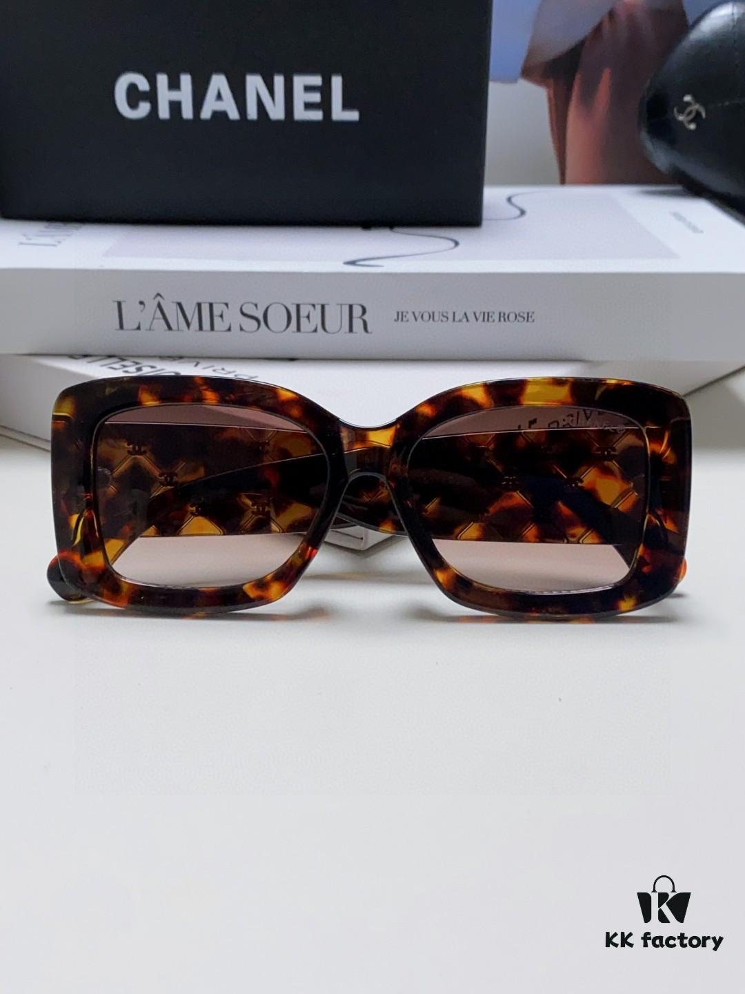 CHANEL New Classic Black and White Sunglasses with Logo-Embellished Temples