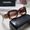 CHANEL New Classic Black and White Sunglasses with Logo-Embellished Temples