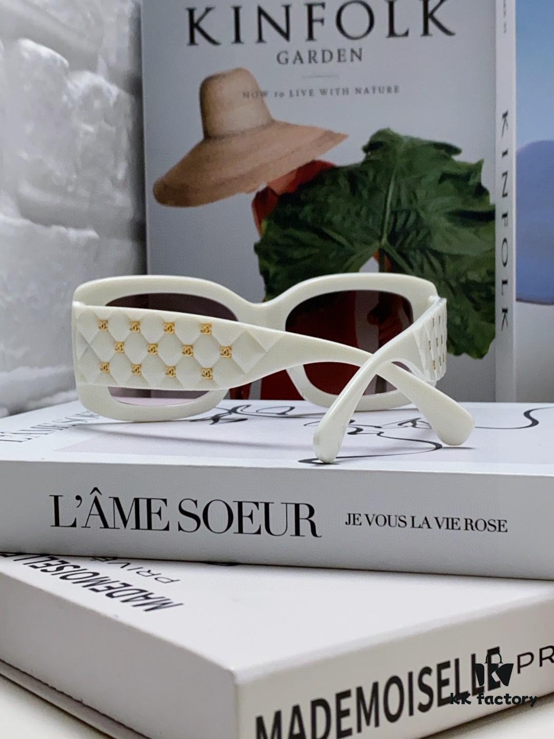 CHANEL New Classic Black and White Sunglasses with Logo-Embellished Temples