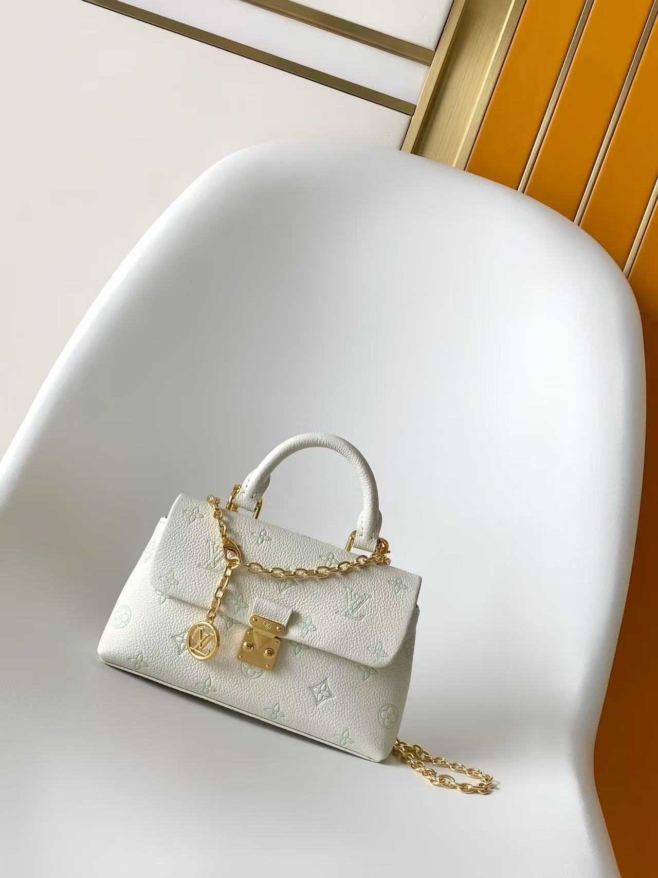 Louis Vuitton This Nano Madeleine handbag reimagines the Madeleine in Monogram Empreinte leather.