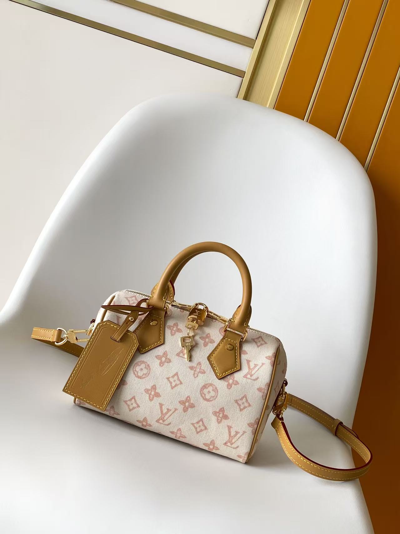 Louis VuittonThis Speedy Bandoulière 20 handbag encapsulates the design of the brand's traditional Speedy travel bag.