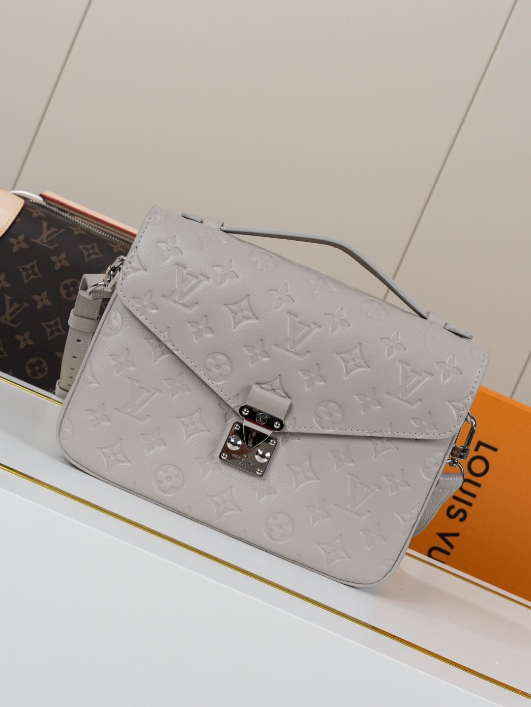Louis Vuitton The Pochette Métis handbag interprets classic collegiate style through a design that is understated yet full of ingenious details.