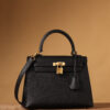 Hermes Kelly bag, black, 25cm, with gold hardware.