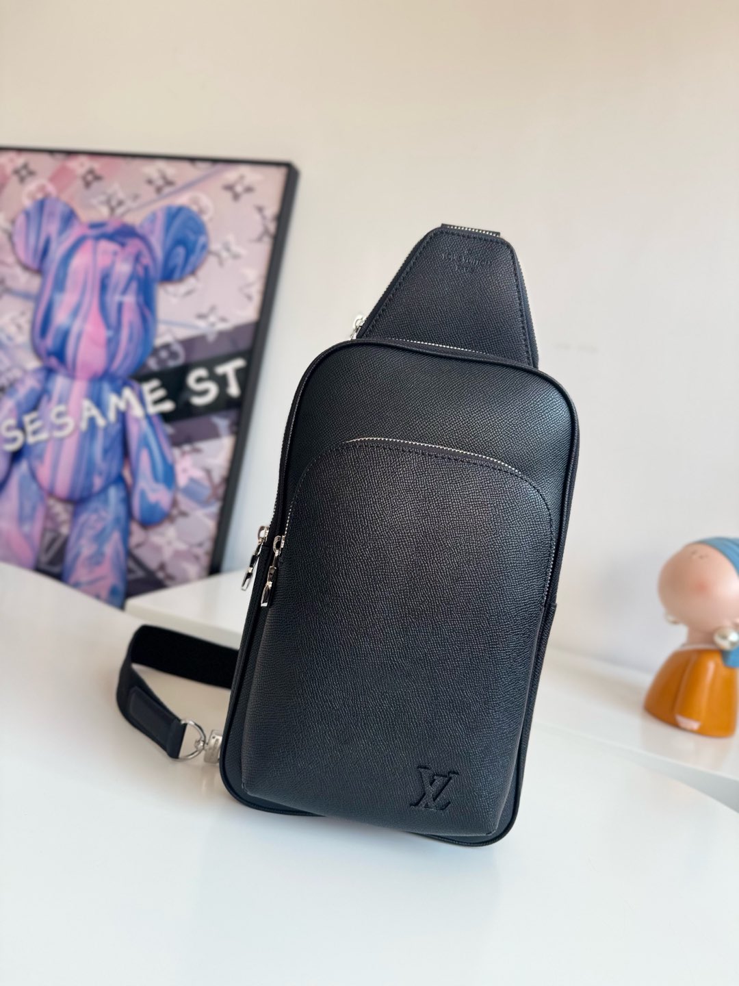 Louis Vuitton This Avenue shoulder bag is crafted from Taïga cowhide leather.