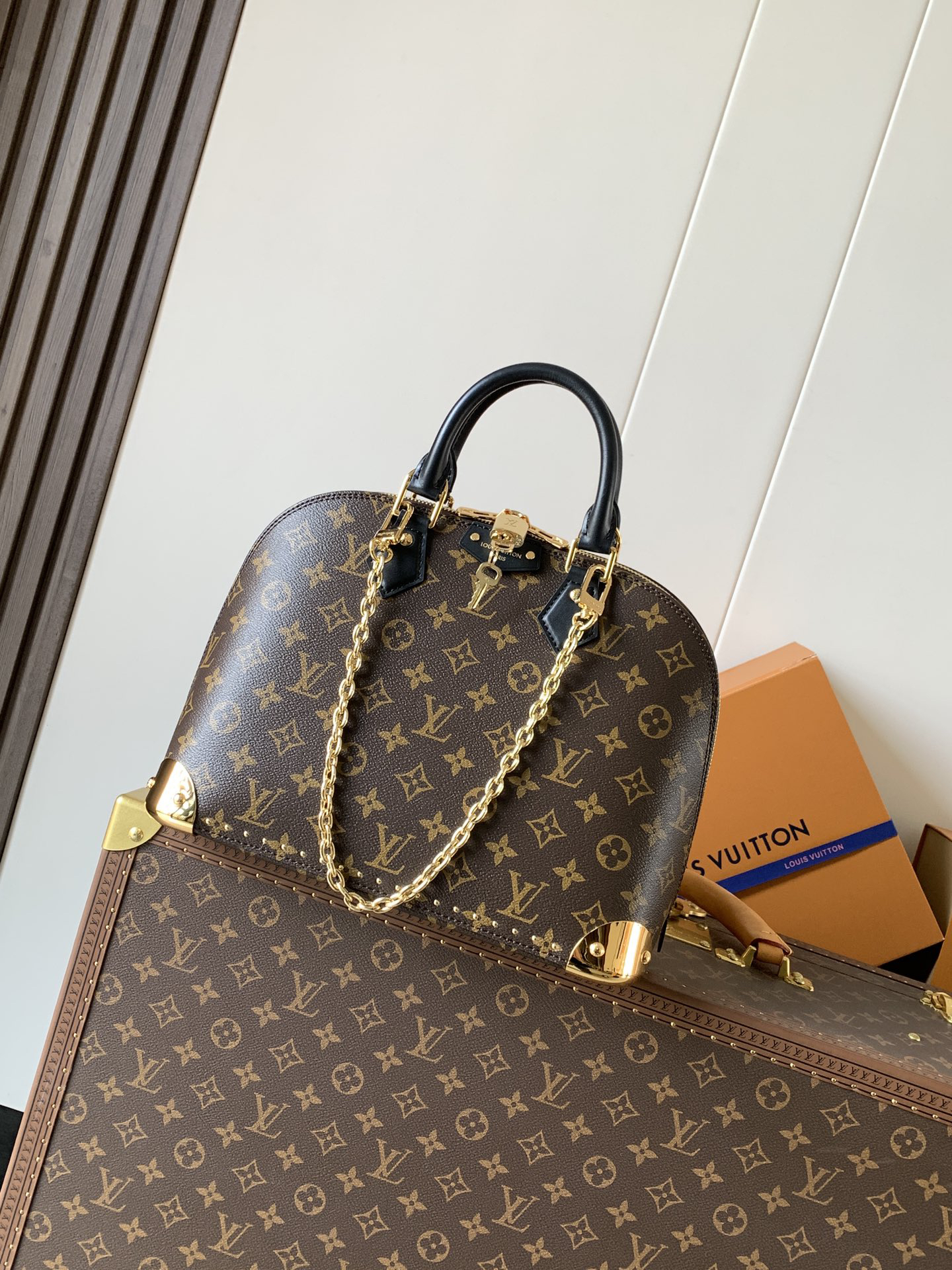 Louis Vuitton The Trunk collection welcomes a contemporary new iteration of the Alma Small handbag, paying homage to the brand's travel heritage with exquisite metal hardware.
