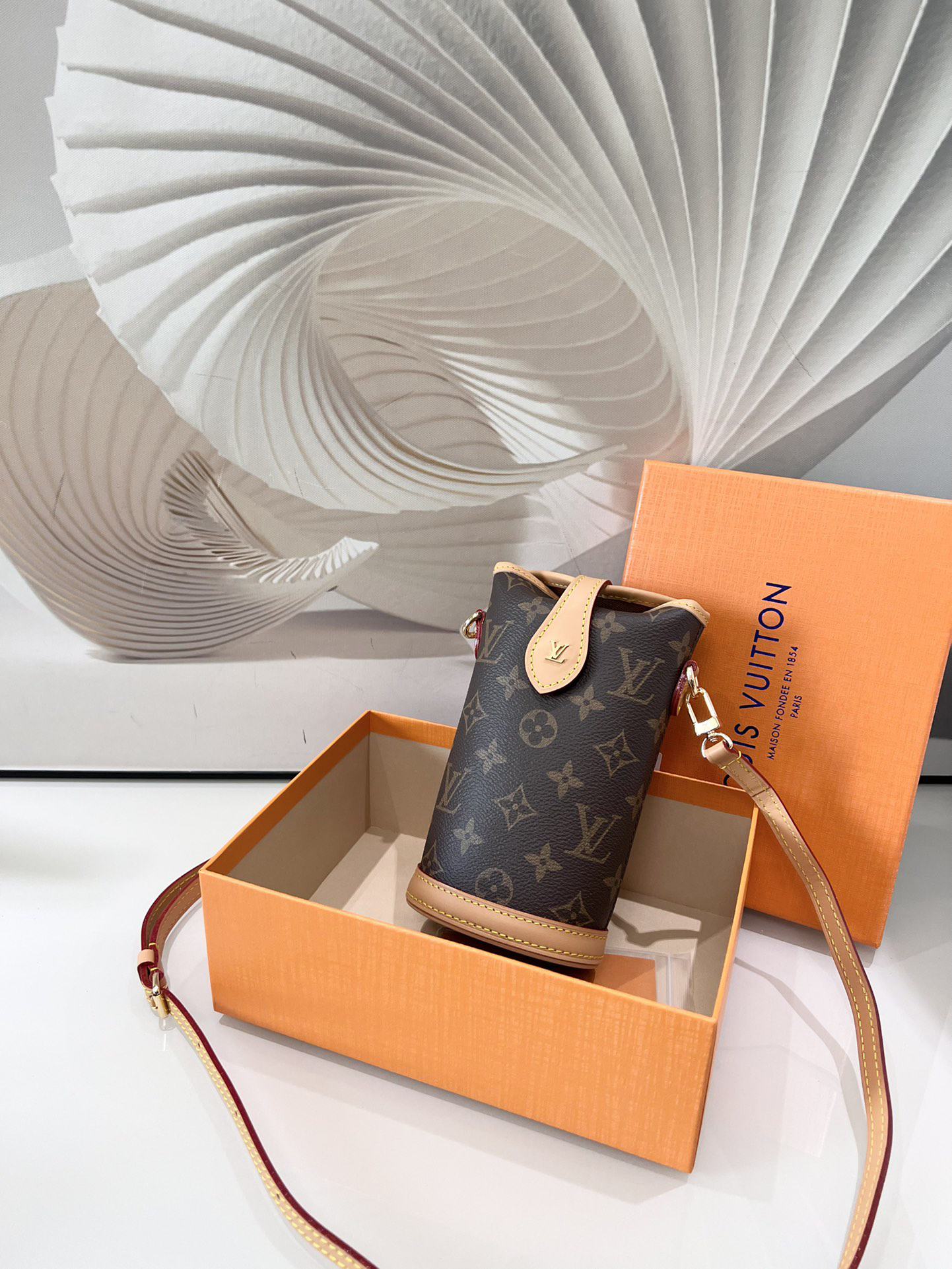 Louis Vuitton Mini Ice Cream Cone Bag — New "Fold Me" Mini Model, featuring a magnetic button closure design.