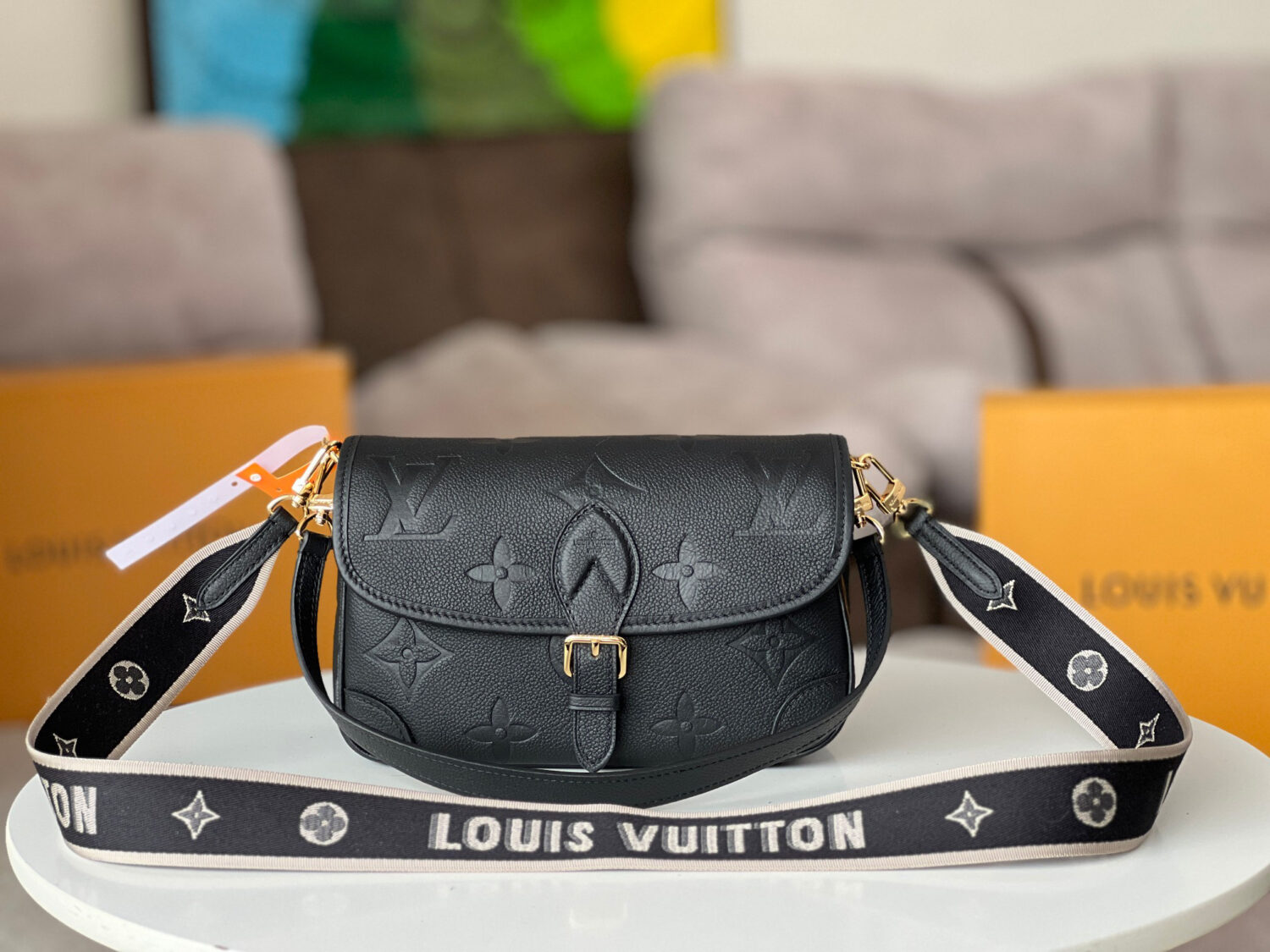 Louis Vuitton This Diane handbag is crafted from Louis Vuitton's classic Monogram Empreinte embossed leather.