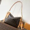 Louis Vuitton This large Side Trunk handbag features Monogram canvas accented with contrasting leather trim.