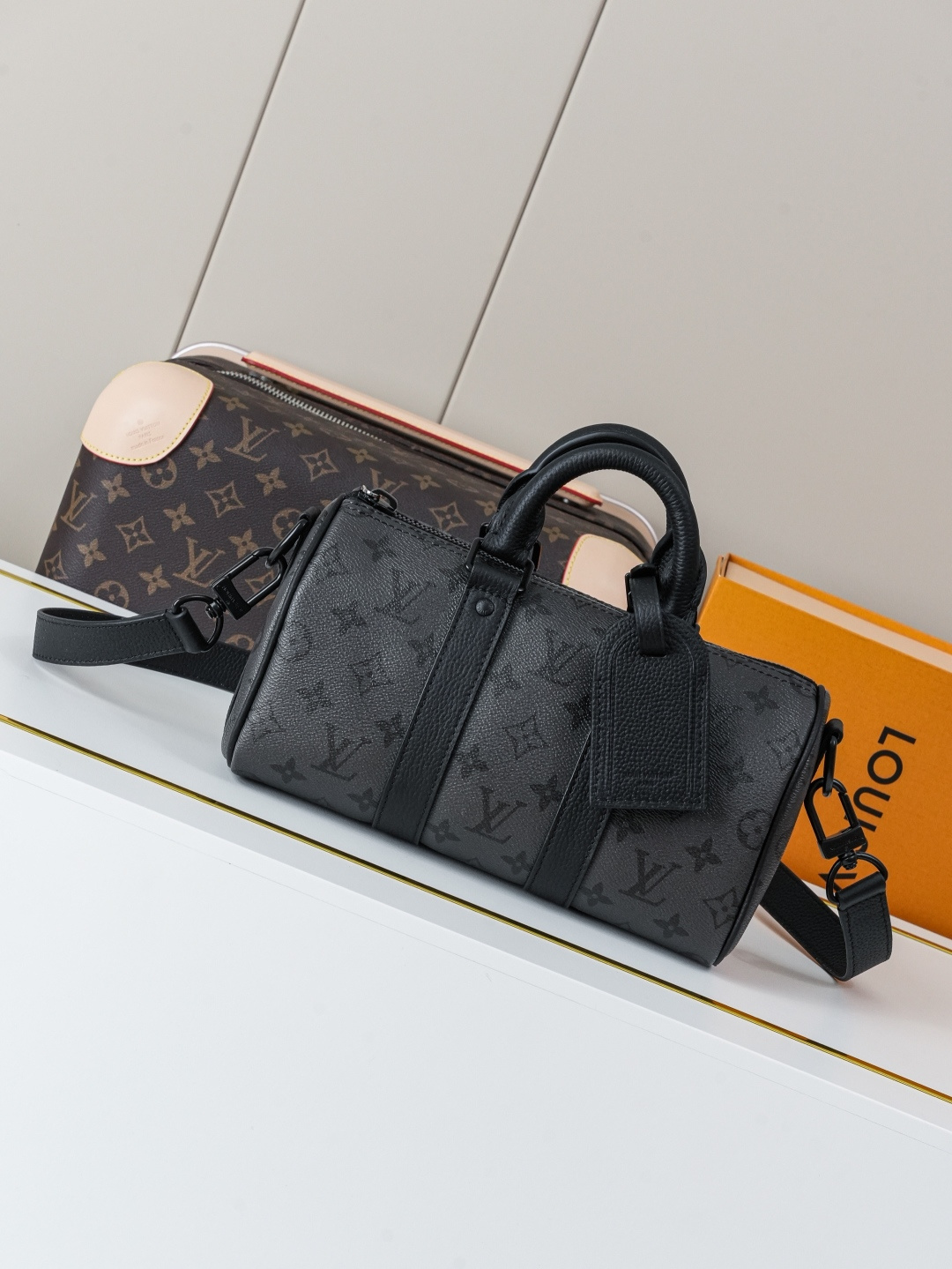 Louis Vuitton This Keell Bandoulière 25 handbag features Monogram Midnight coated canvas accented with a deep Monogram print.