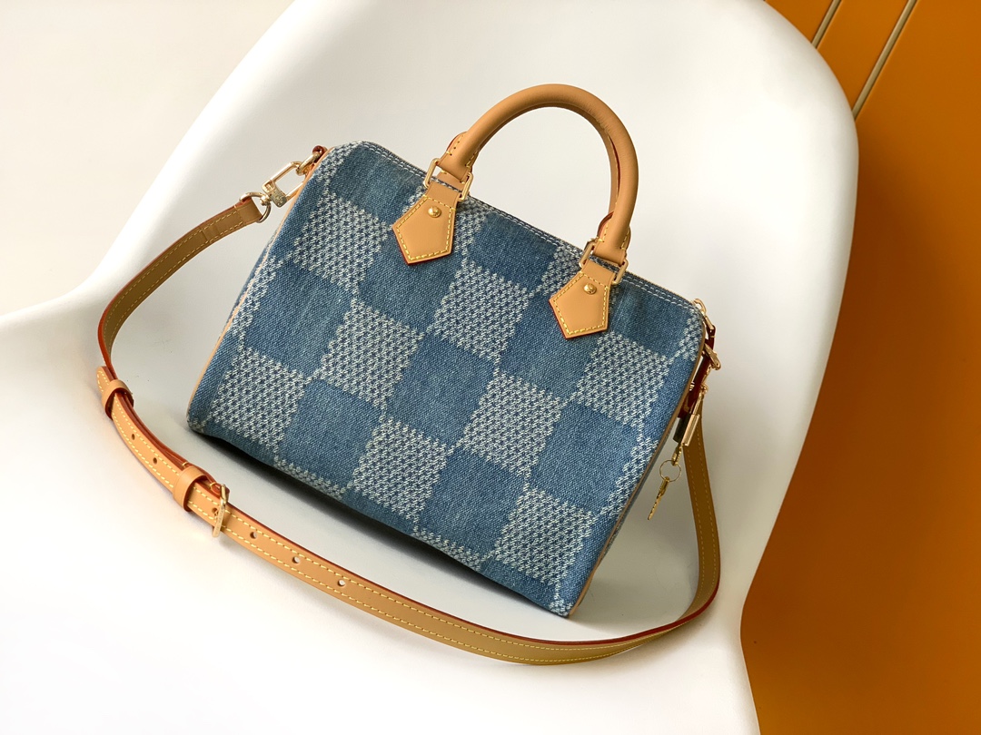 Louis Vuitton The new FW Denim Speedy 25 handbag—whether worn crossbody...