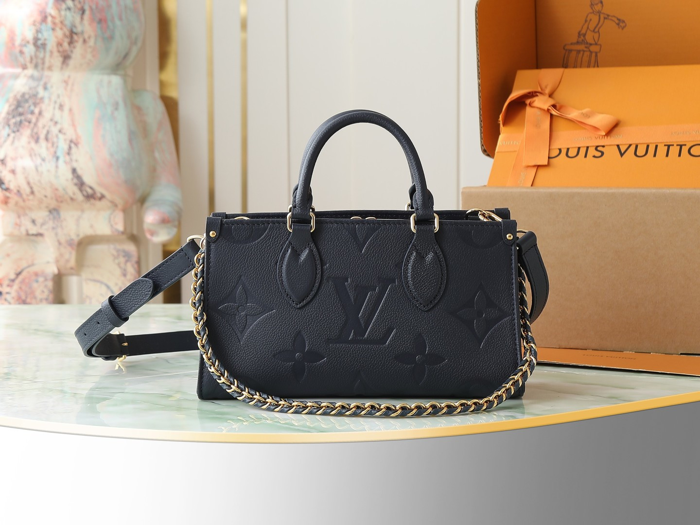 Louis Vuitton M23640 Deep Blue Embossed: This small OnTheGo handbag is crafted from Monogram Empreinte leather, embossed with the Giant Monogram pattern.