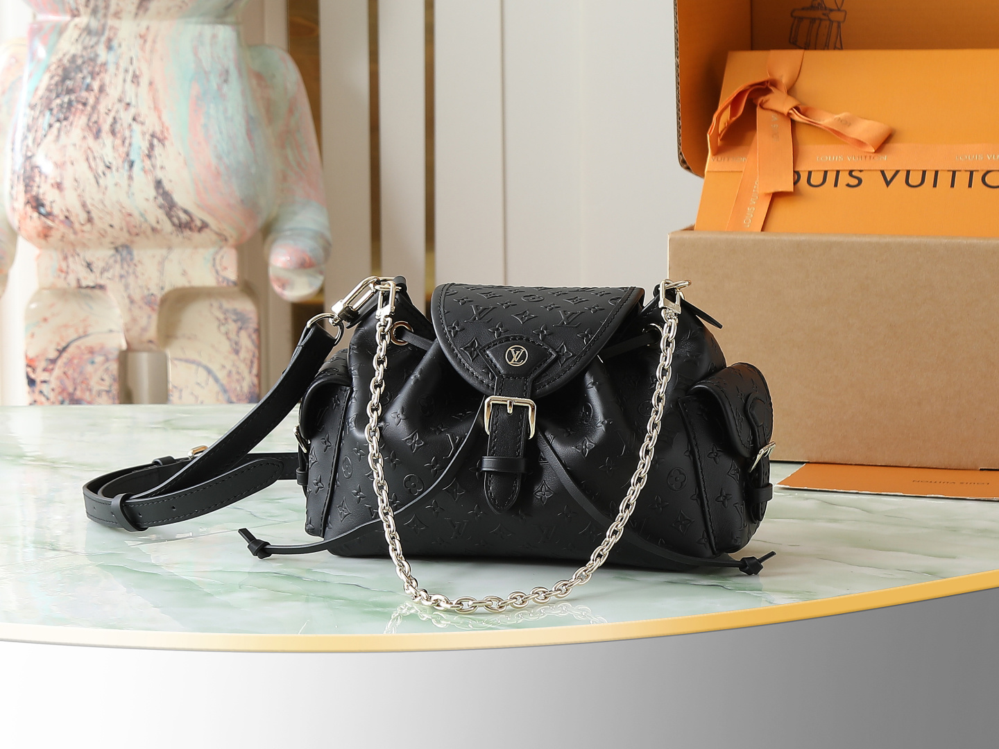 Louis Vuitton The M25554 Odyssée handbag in black full leather, hailing from the Early Autumn 2025 collection, cleverly references the 2024 Cruise collection.