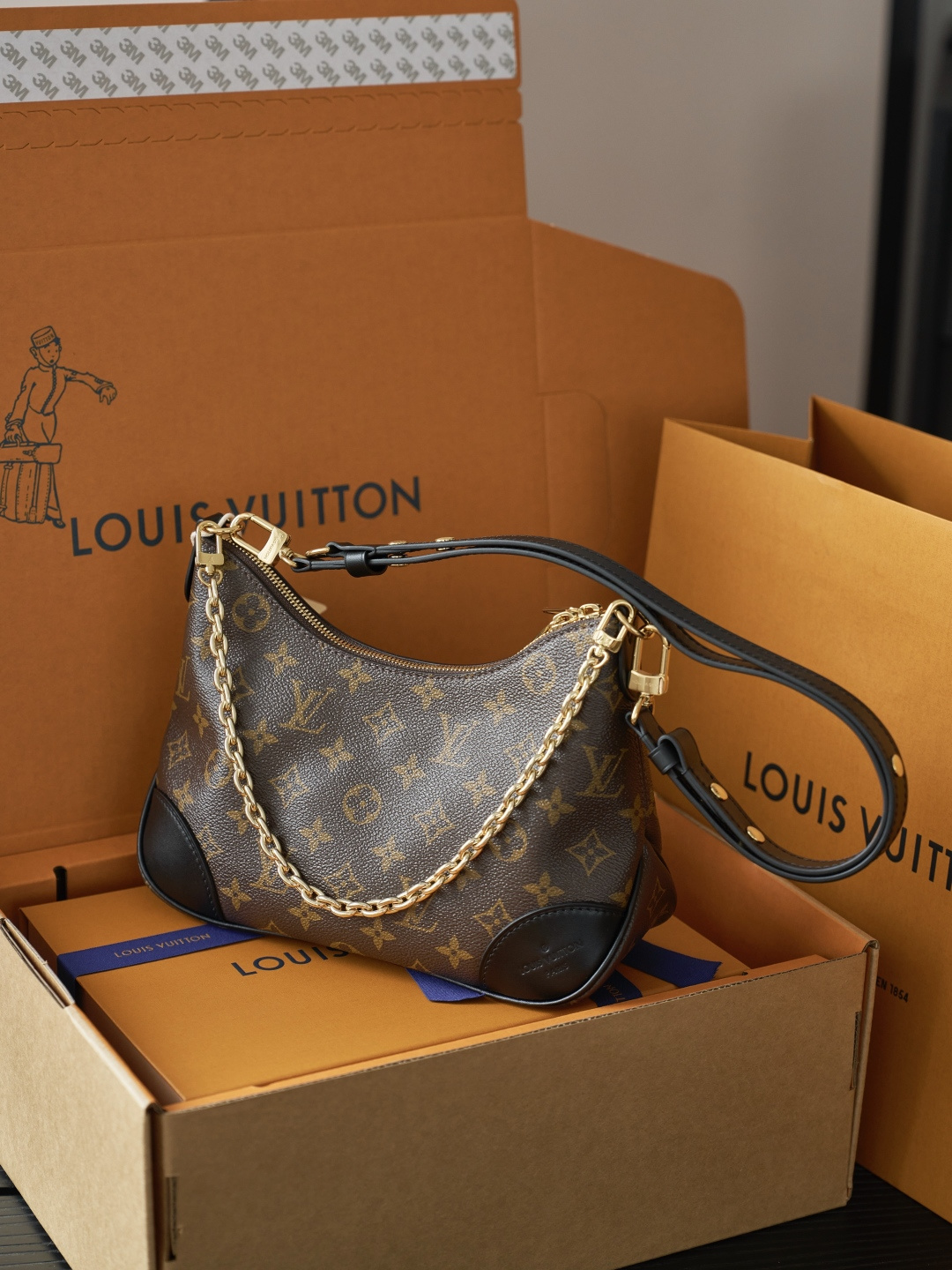 Louis Vuitton Crafted from classic Monogram canvas, this small Boulogne handbag features a double-zip closure and a spacious interior flat pocket large enough to accommodate a smartphone.