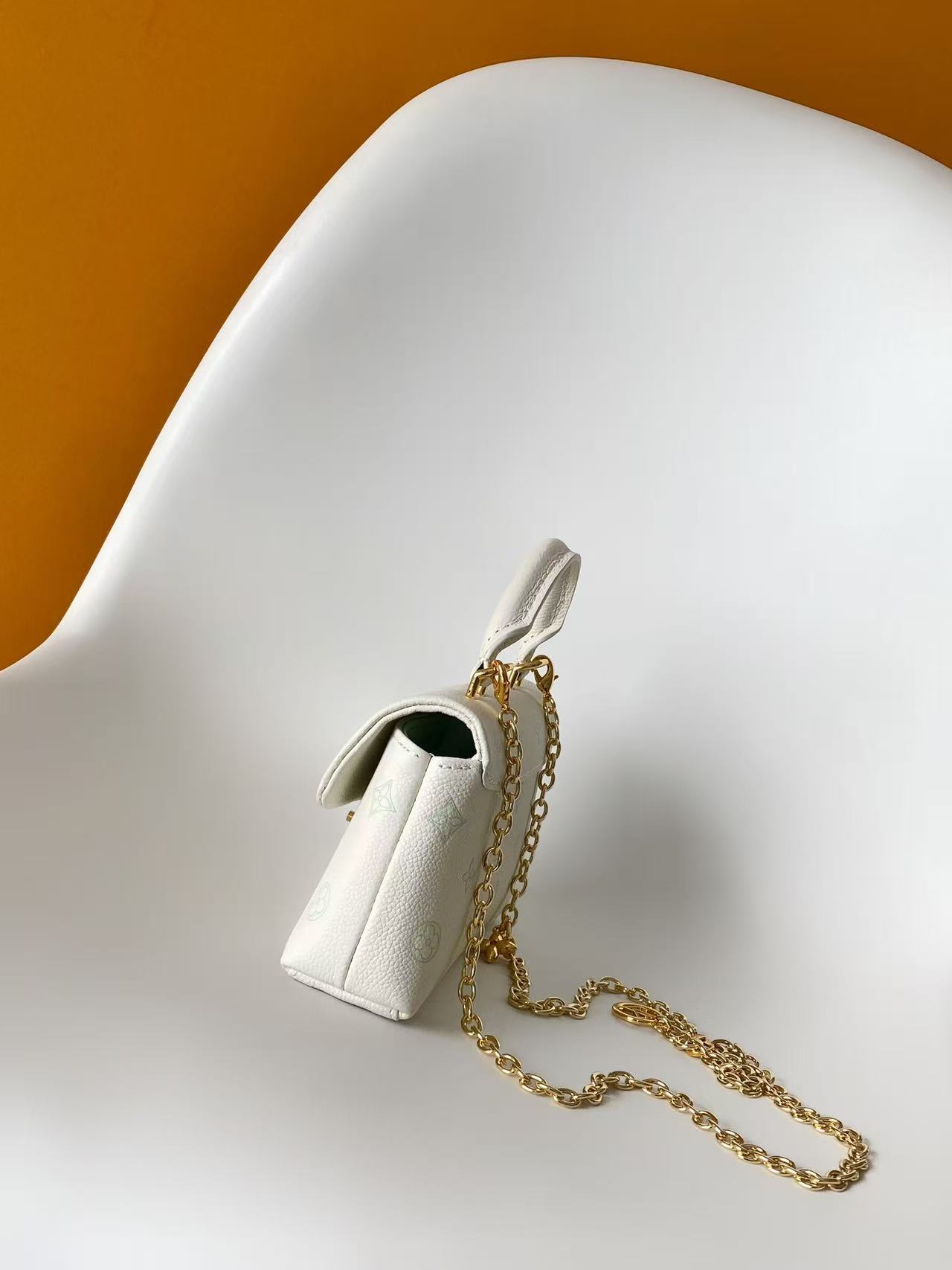 Louis Vuitton This Nano Madeleine handbag reimagines the Madeleine in Monogram Empreinte leather.