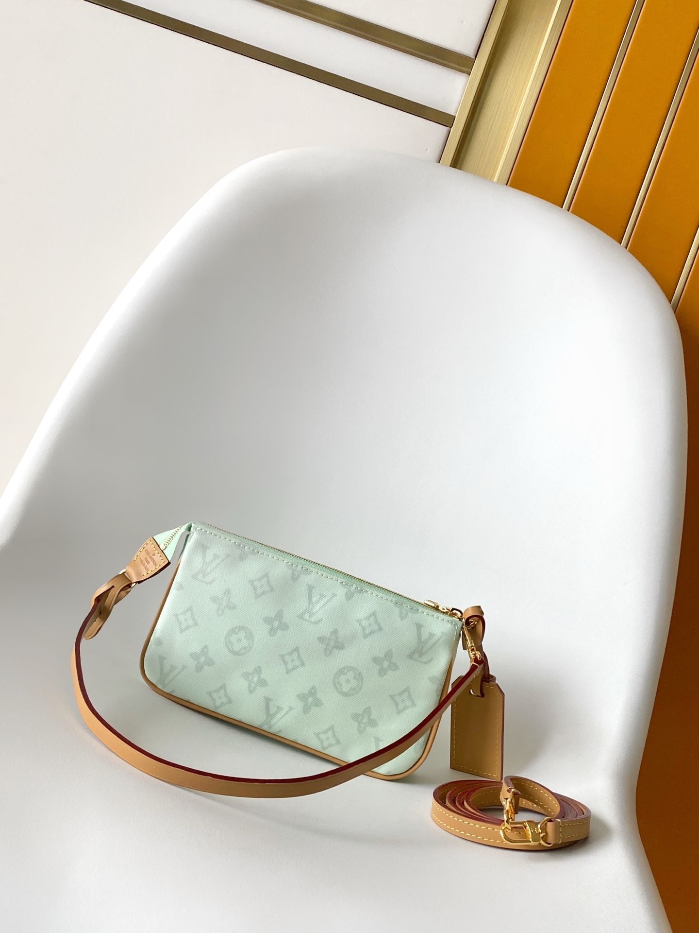 Louis Vuitton This Pochette Accessoires handbag is specially designed to celebrate the birth of the Louis Vuitton Monogram pattern.