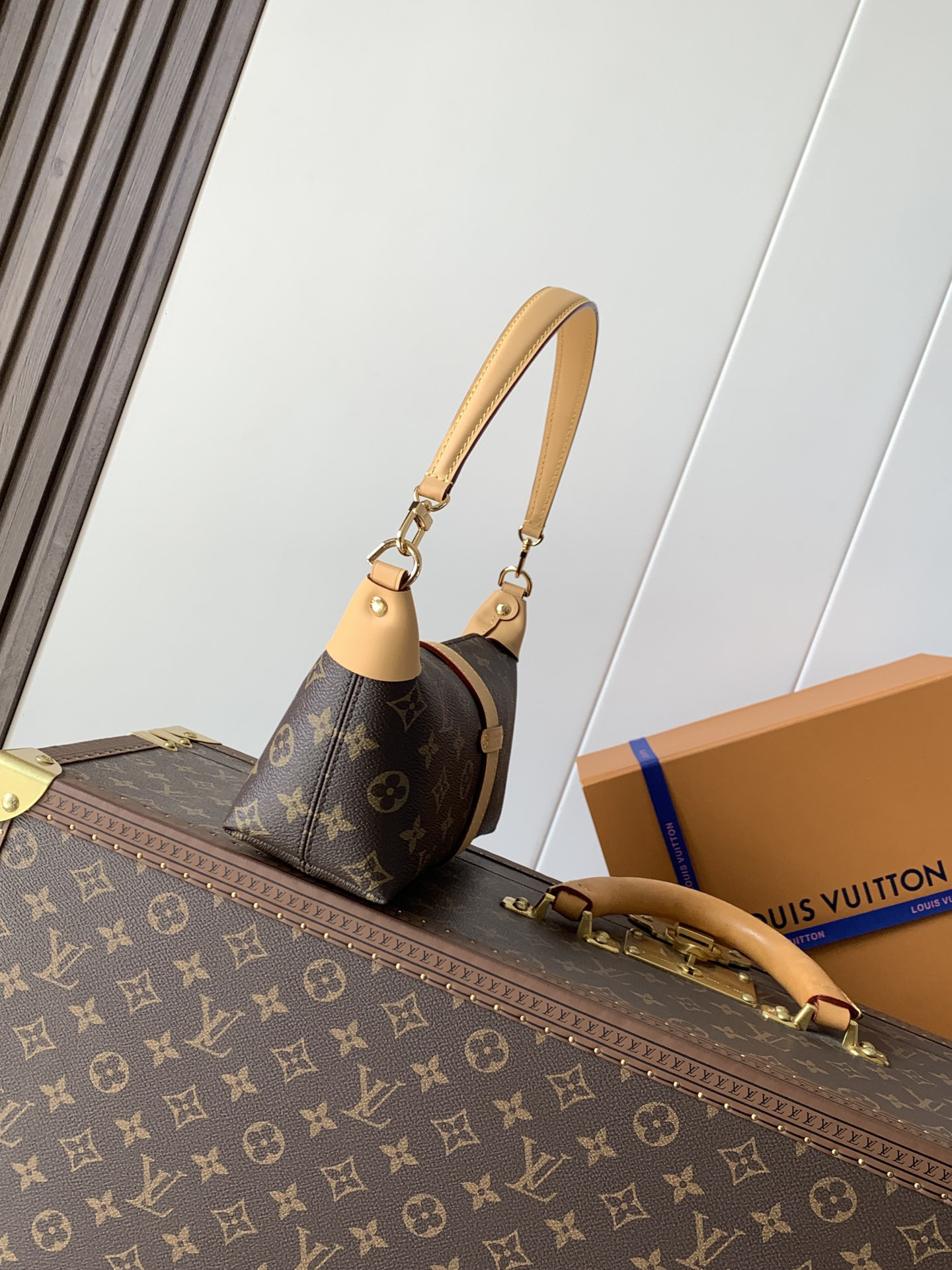 Louis Vuitton This Pochette Mia handbag, part of the Monogram collection, features a Monogram canvas body accented with cowhide leather trim.