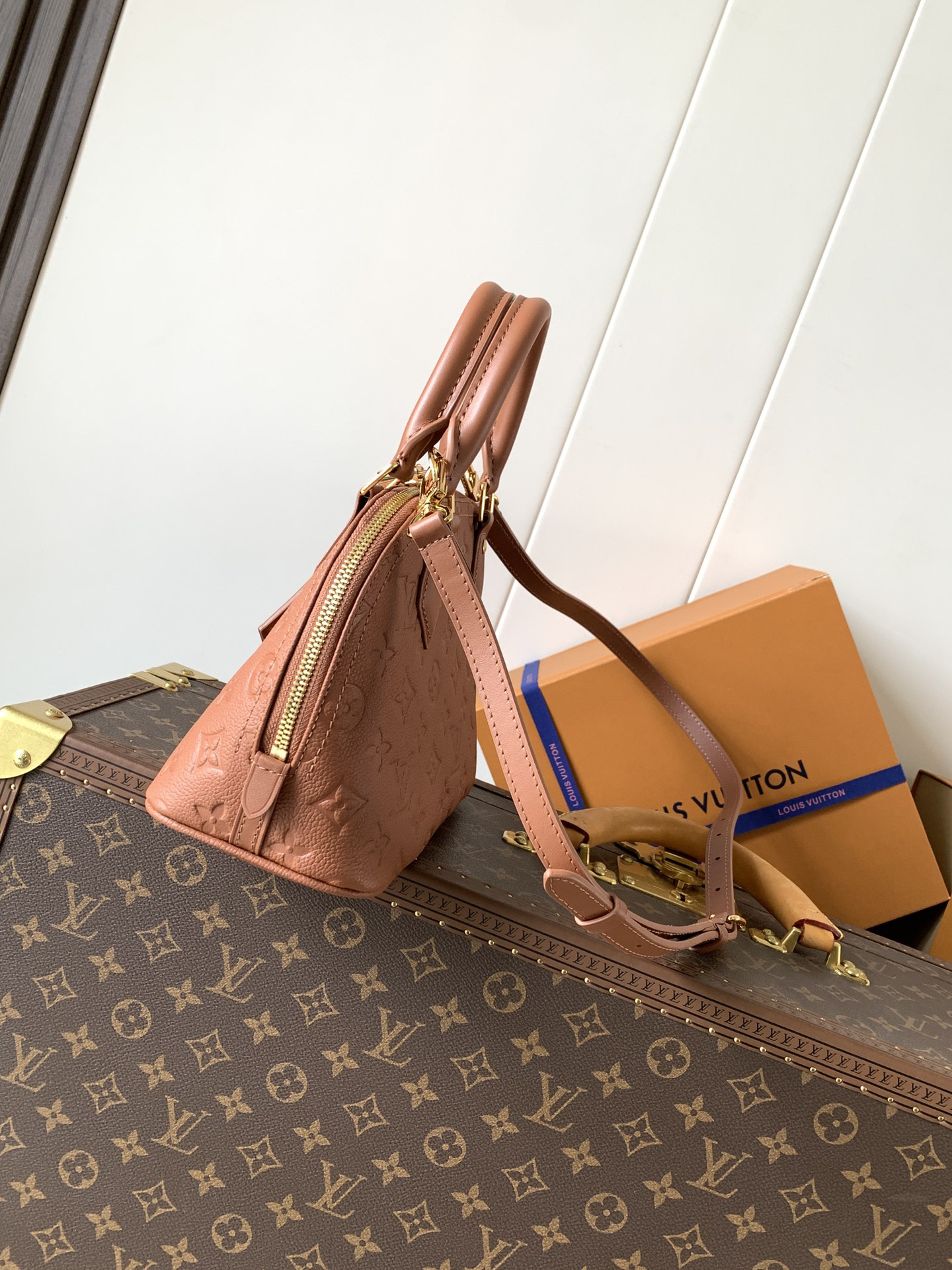 Louis Vuitton This Alma BB handbag showcases the iconic Alma BB silhouette, crafted from the House's exceptionally soft Monogram Empreinte leather.