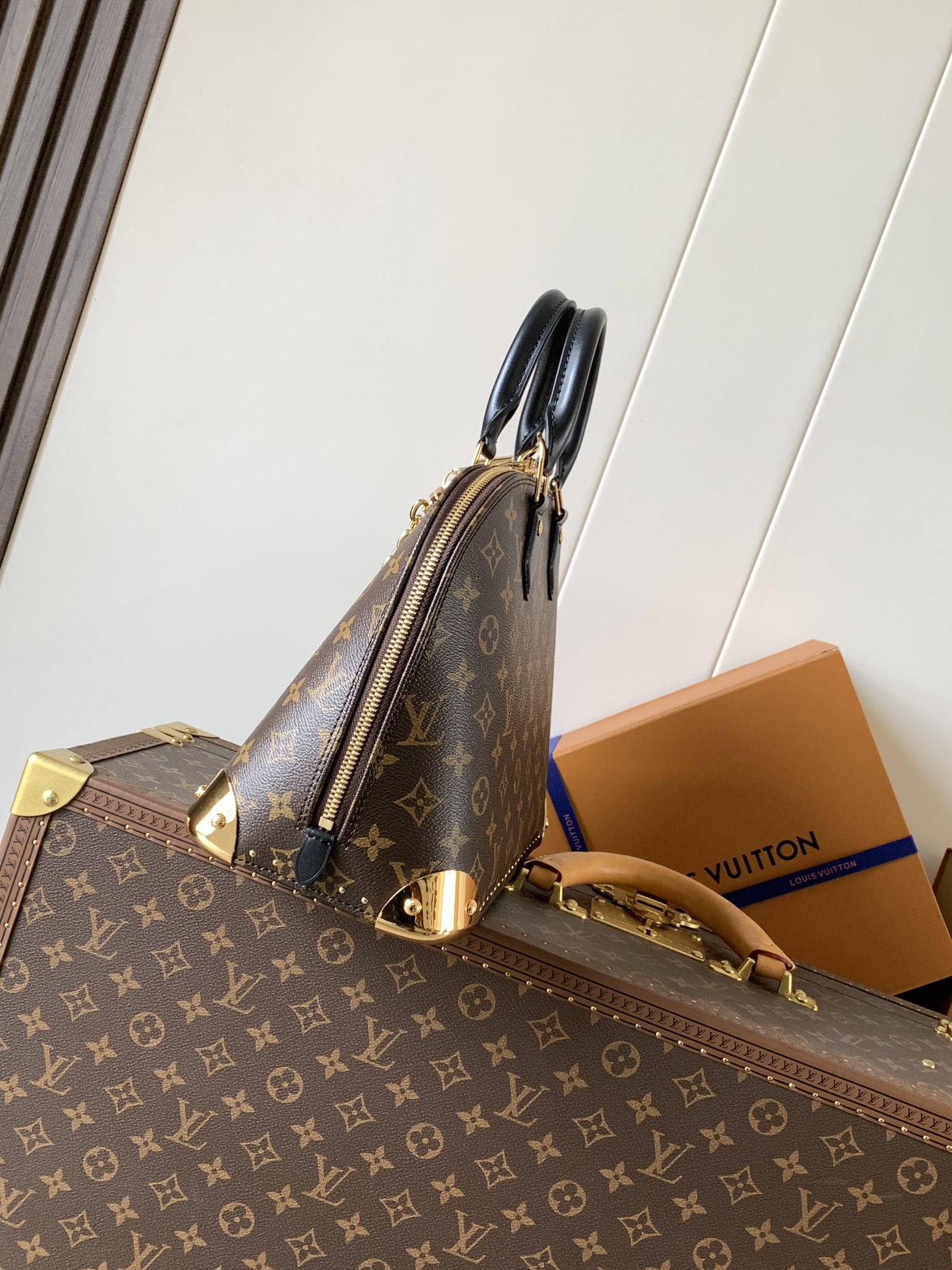 Louis Vuitton The Trunk collection welcomes a contemporary new iteration of the Alma Small handbag, paying homage to the brand's travel heritage with exquisite metal hardware.