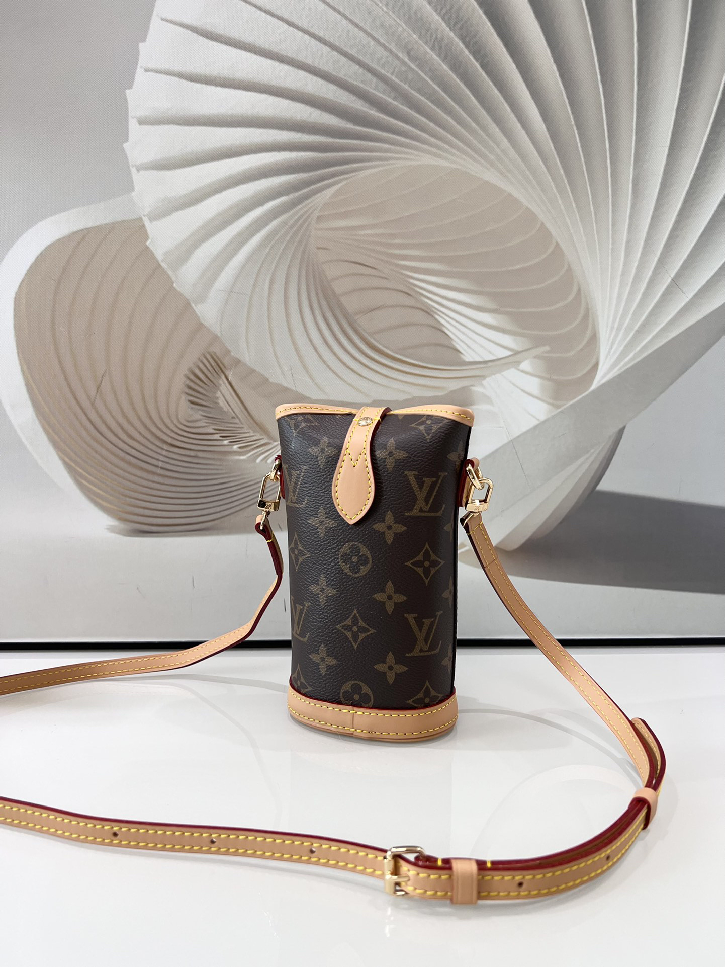 Louis Vuitton Mini Ice Cream Cone Bag — New "Fold Me" Mini Model, featuring a magnetic button closure design.