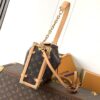 Louis Vuitton This large Side Trunk handbag features Monogram canvas accented with contrasting leather trim.