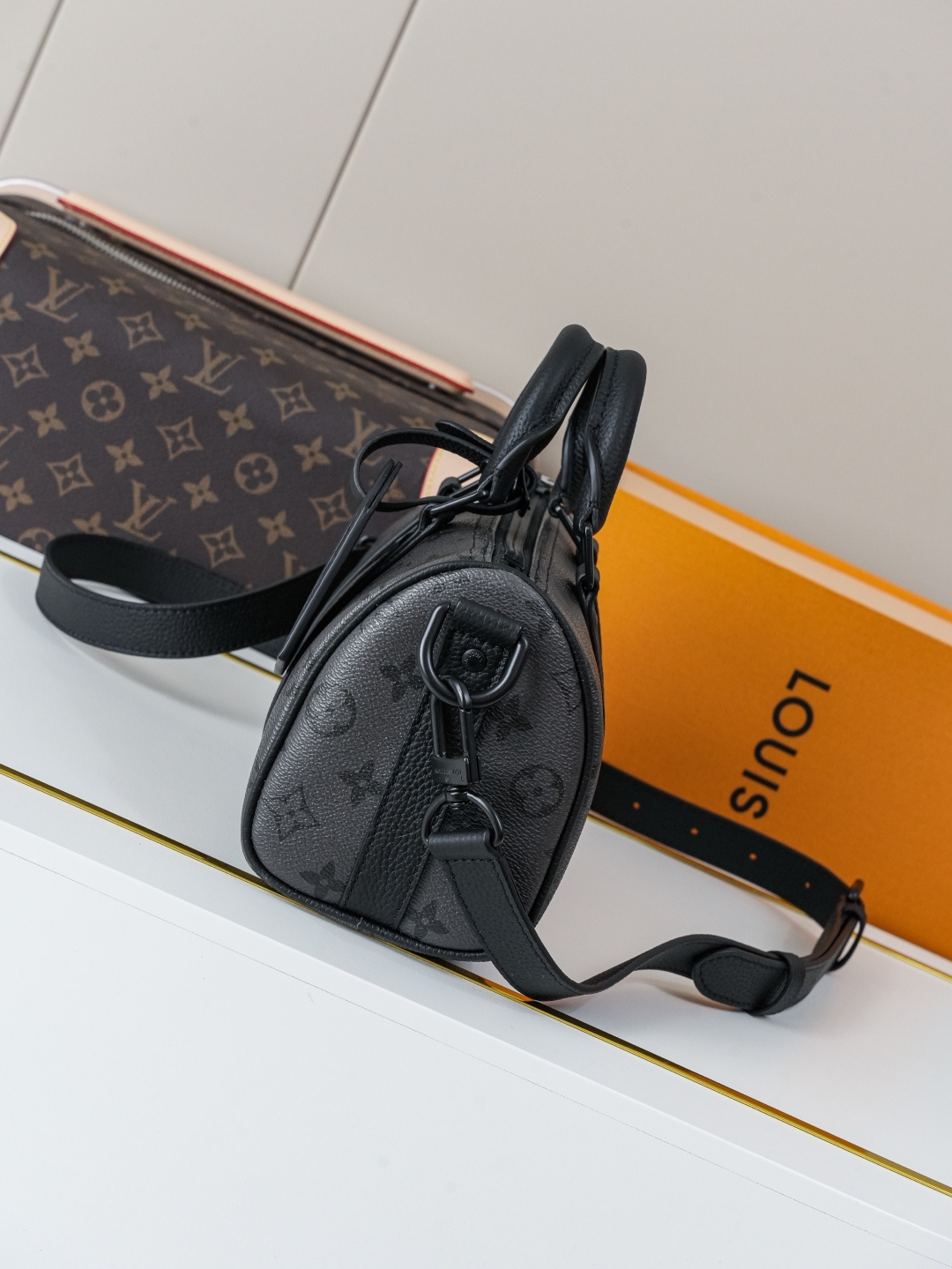 Louis Vuitton This Keell Bandoulière 25 handbag features Monogram Midnight coated canvas accented with a deep Monogram print.