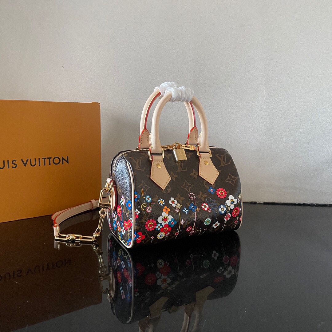Louis Vuitton This Speedy Bandoulière 20 handbag combines Monogram canvas with cowhide leather trim.