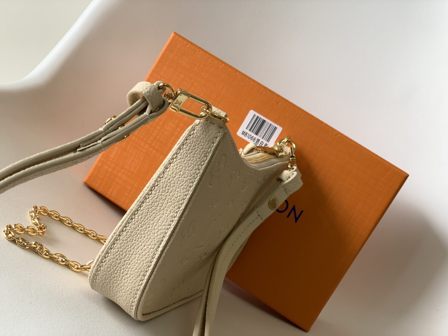 Louis Vuitton The Easy Pouch On Strap handbag from the Spring 2022 Collection is crafted from Monogram Empreinte leather.