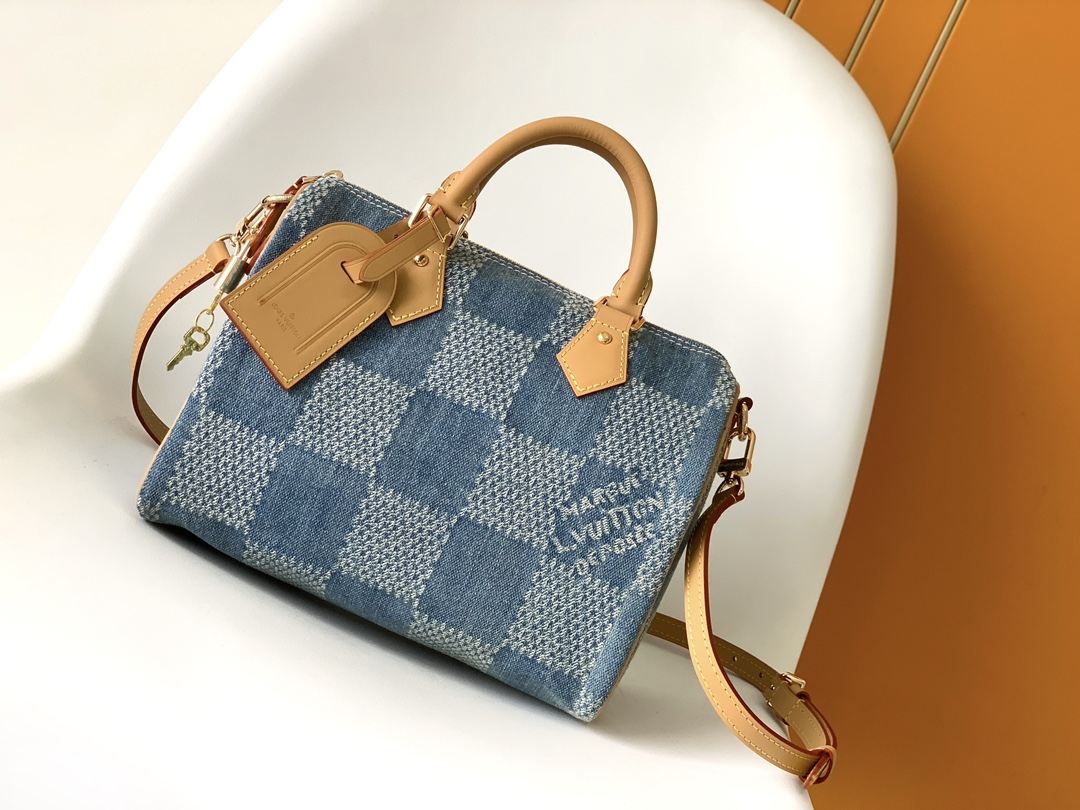 Louis Vuitton The new FW Denim Speedy 25 handbag—whether worn crossbody...