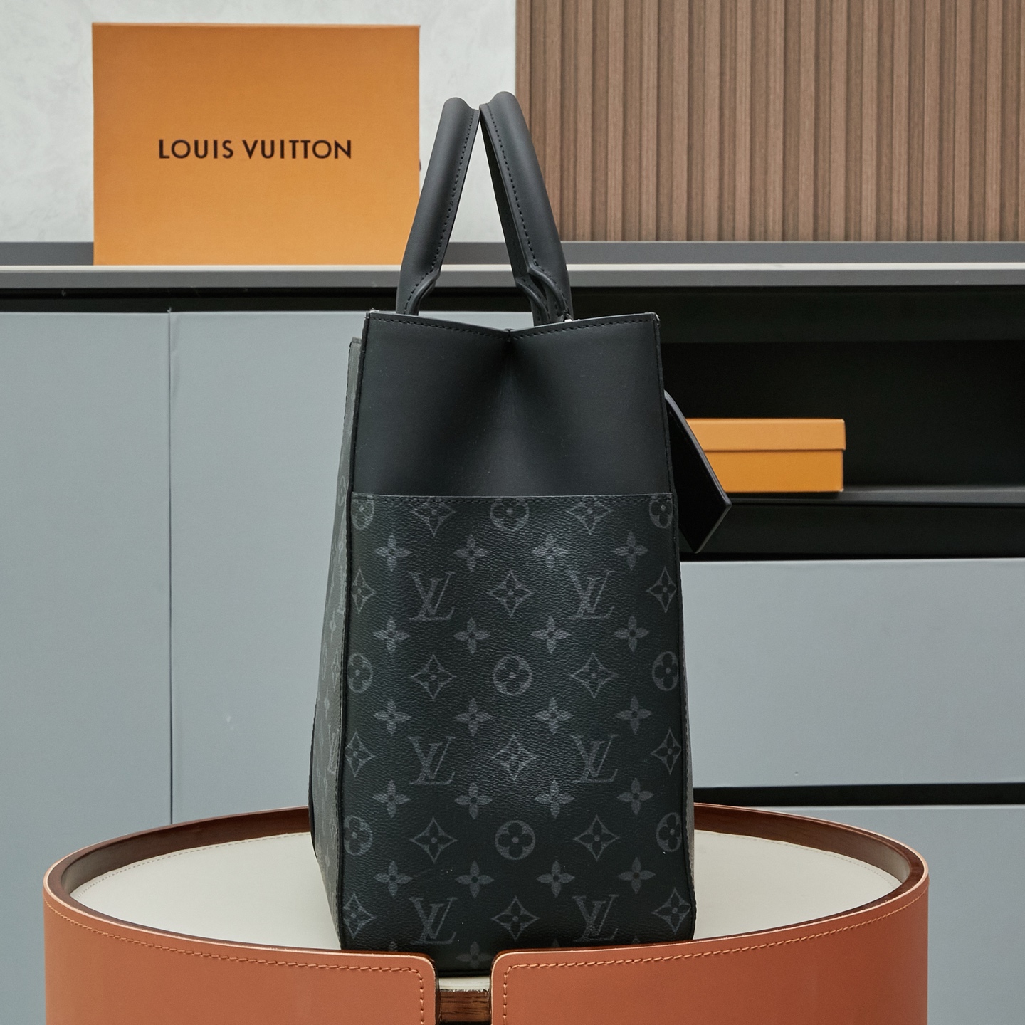 Louis Vuitton M46451 Black Monogram: A spacious handbag from the Sac Plat collection, the Sac Plat 24H features leather trim.