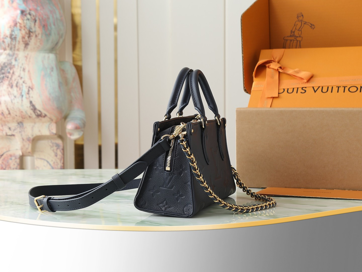 Louis Vuitton M23640 Deep Blue Embossed: This small OnTheGo handbag is crafted from Monogram Empreinte leather, embossed with the Giant Monogram pattern.