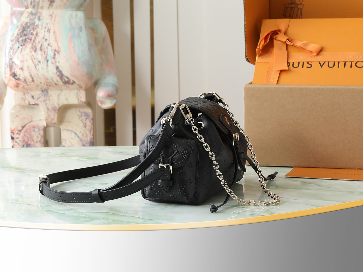 Louis Vuitton The M25554 Odyssée handbag in black full leather, hailing from the Early Autumn 2025 collection, cleverly references the 2024 Cruise collection.