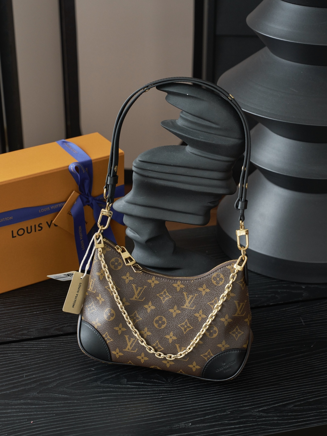 Louis Vuitton Crafted from classic Monogram canvas, this small Boulogne handbag features a double-zip closure and a spacious interior flat pocket large enough to accommodate a smartphone.