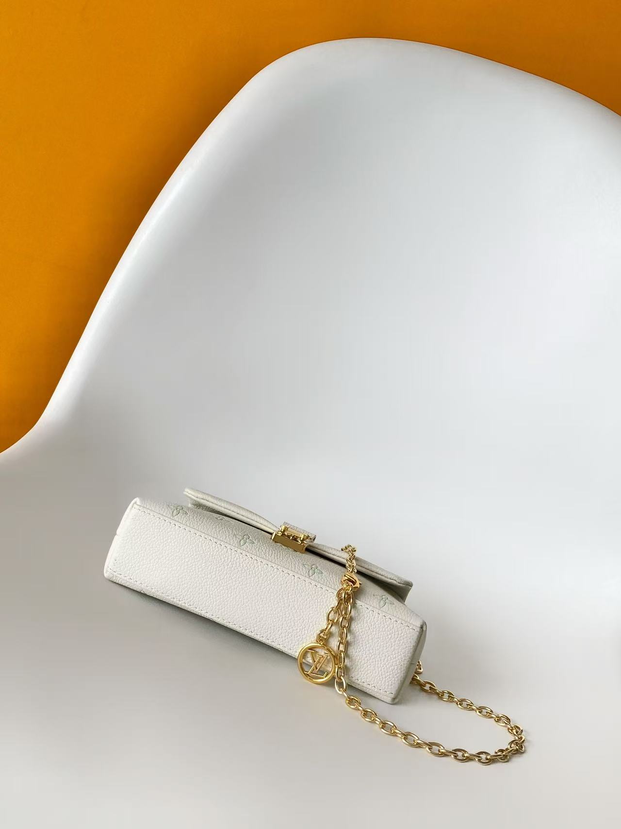 Louis Vuitton This Nano Madeleine handbag reimagines the Madeleine in Monogram Empreinte leather.