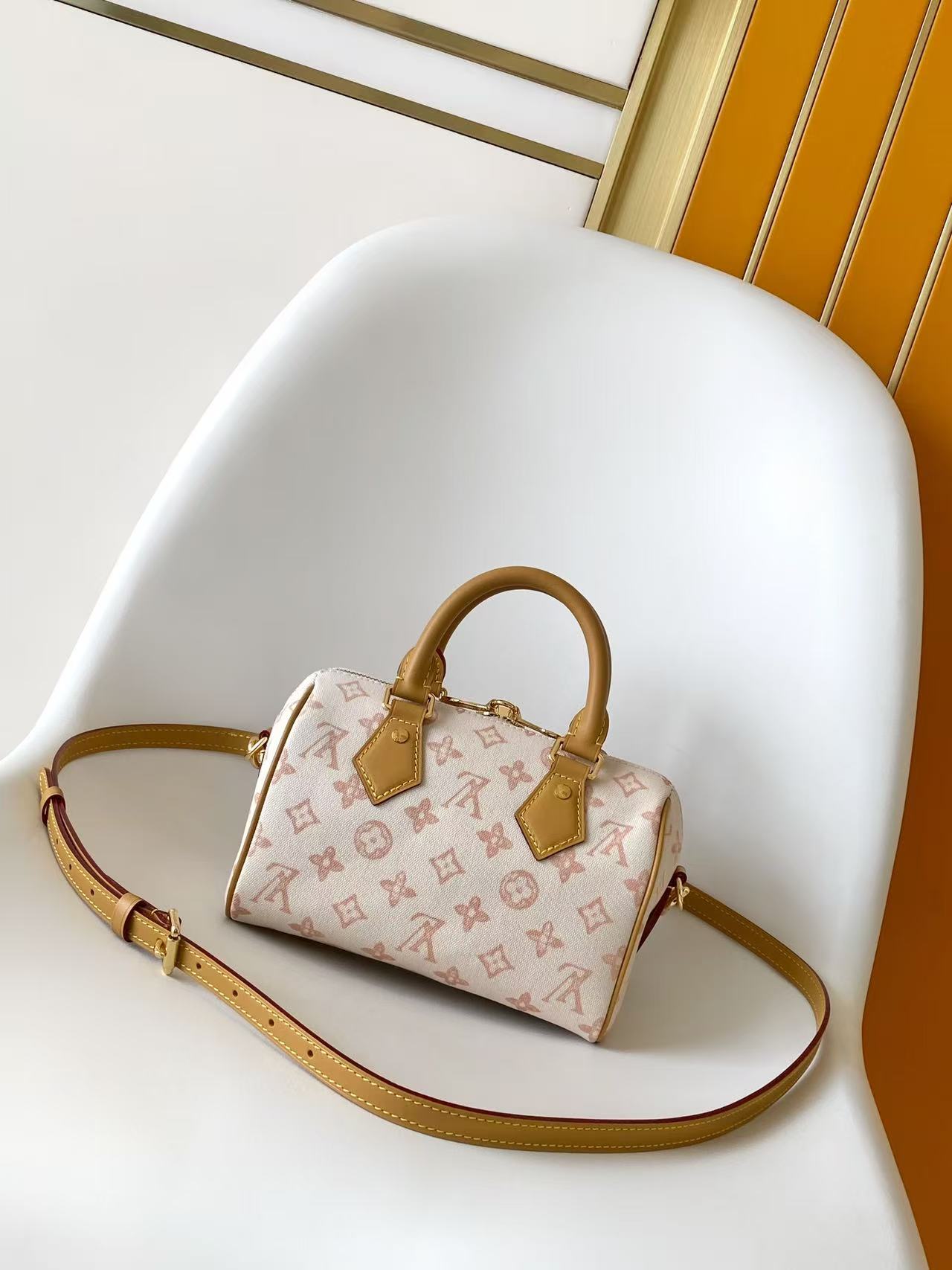 Louis VuittonThis Speedy Bandoulière 20 handbag encapsulates the design of the brand's traditional Speedy travel bag.