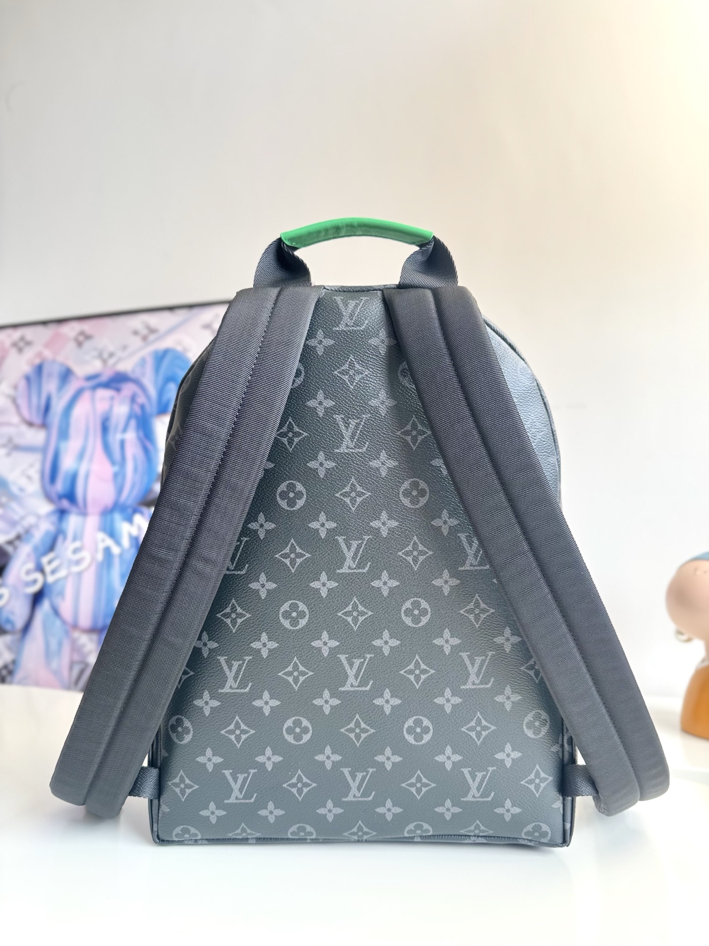 Louis Vuitton This small Discovery backpack features a patchwork of Monogram Eclipse canvas and vibrant cowhide leather.
