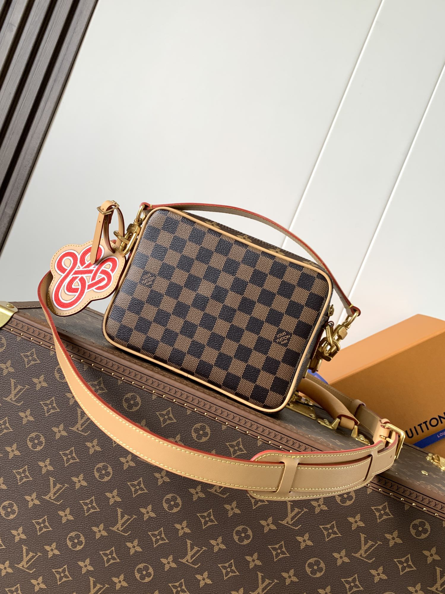 Louis Vuitton This Nil messenger bag features a Monogram canvas body accented with Damier and Monogram Reverse canvas patches, creating an elegant patchwork effect.