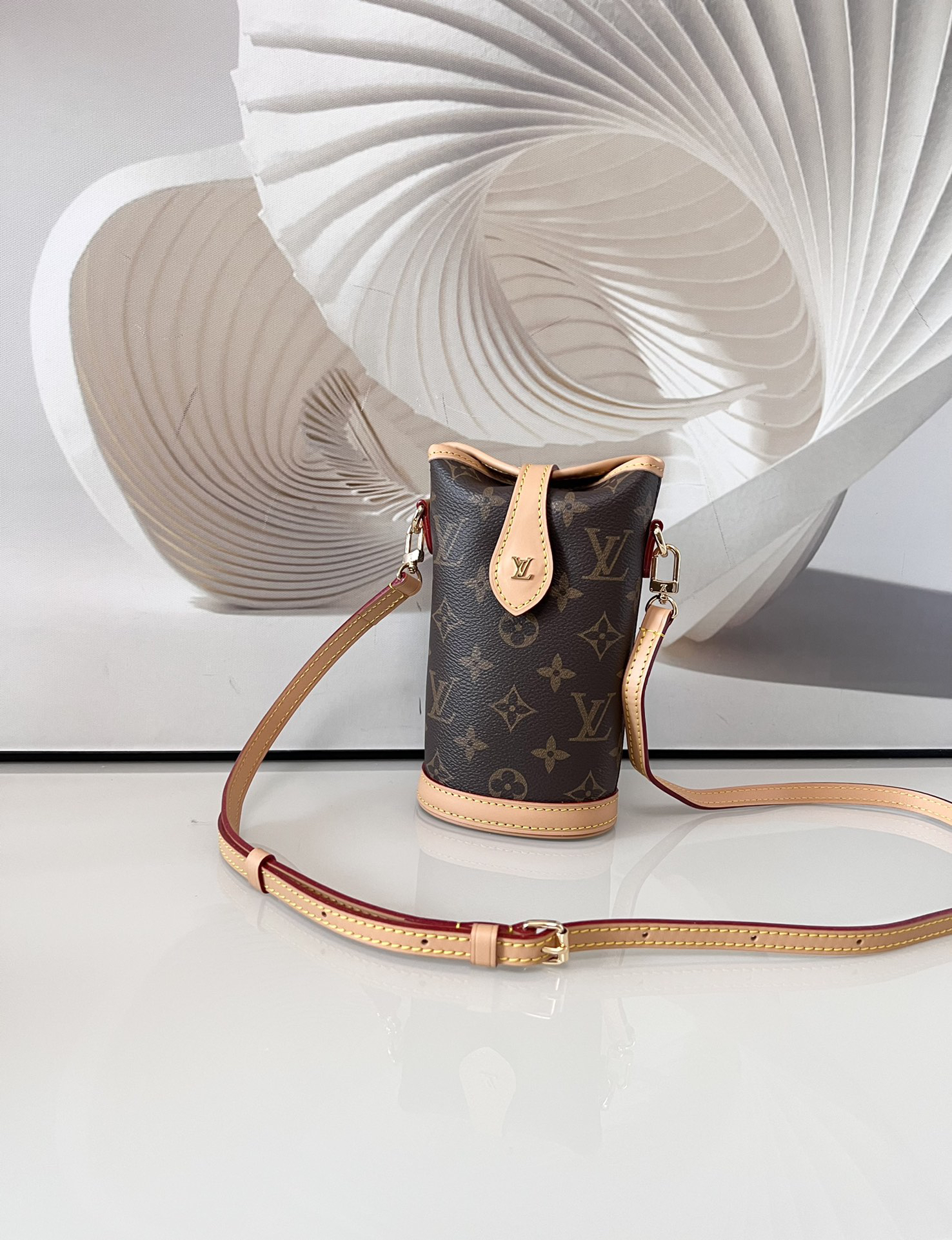 Louis Vuitton Mini Ice Cream Cone Bag — New "Fold Me" Mini Model, featuring a magnetic button closure design.