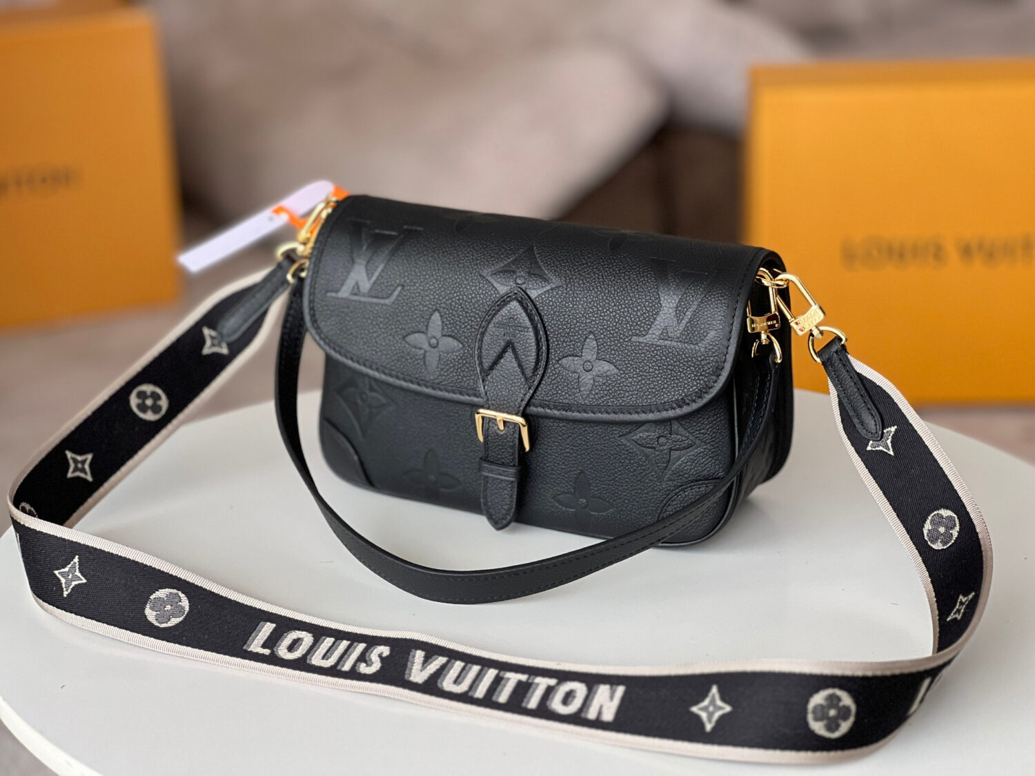 Louis Vuitton This Diane handbag is crafted from Louis Vuitton's classic Monogram Empreinte embossed leather.