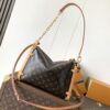 Louis Vuitton This large Side Trunk handbag features Monogram canvas accented with contrasting leather trim.