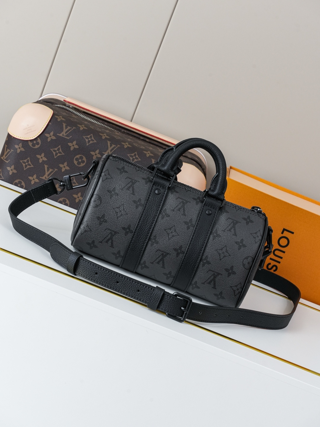 Louis Vuitton This Keell Bandoulière 25 handbag features Monogram Midnight coated canvas accented with a deep Monogram print.