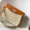 Louis Vuitton The Easy Pouch On Strap handbag from the Spring 2022 Collection is crafted from Monogram Empreinte leather.