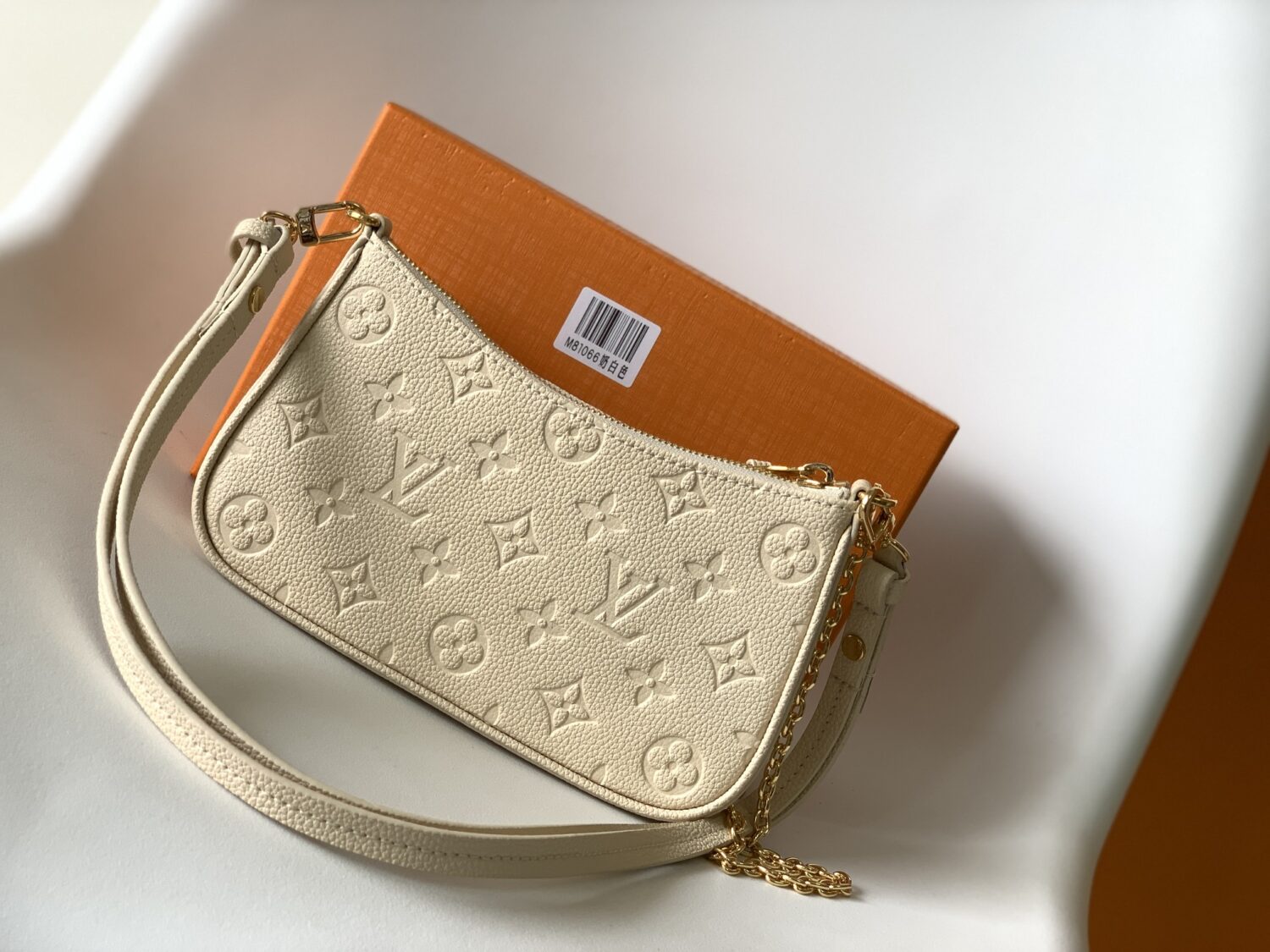 Louis Vuitton The Easy Pouch On Strap handbag from the Spring 2022 Collection is crafted from Monogram Empreinte leather.
