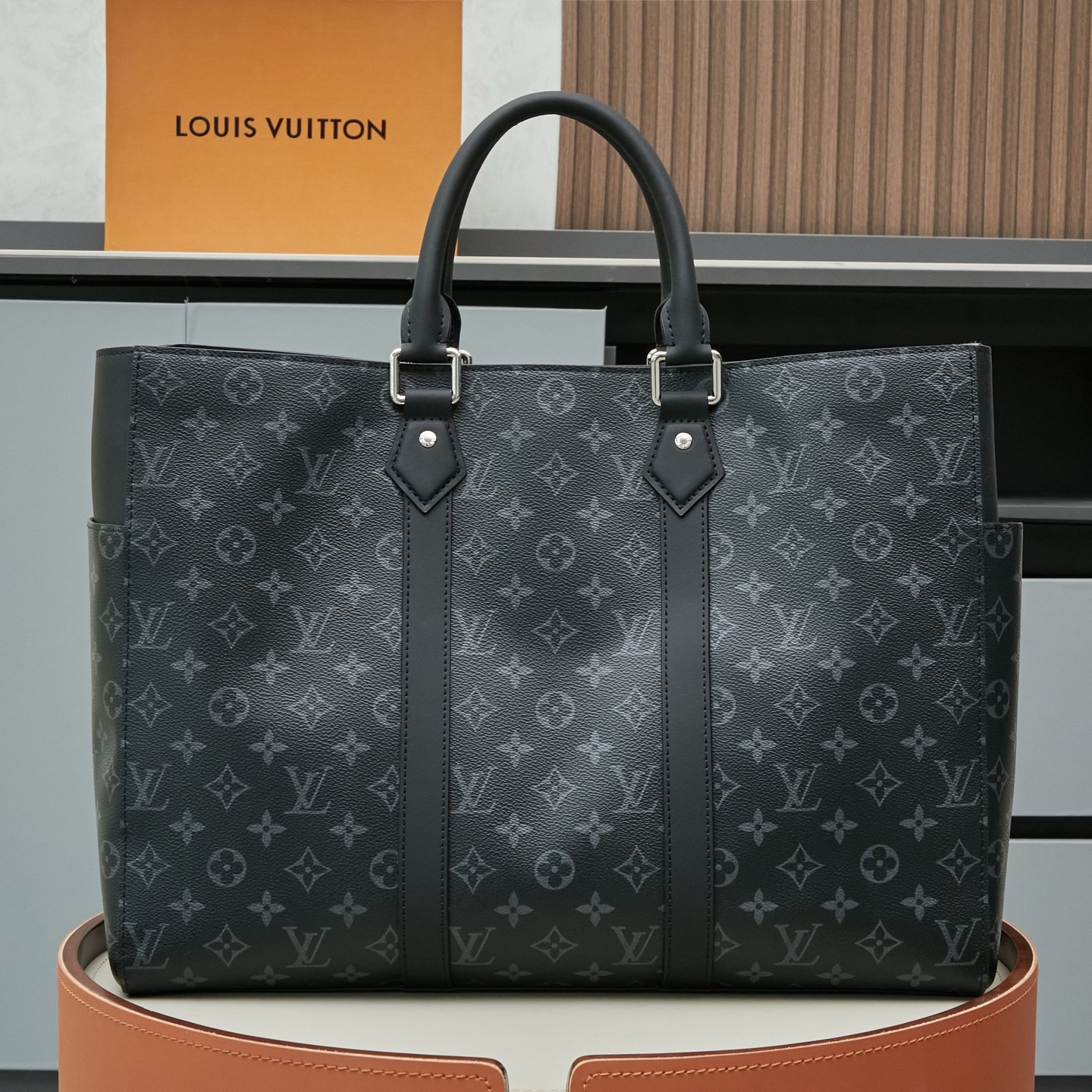 Louis Vuitton M46451 Black Monogram: A spacious handbag from the Sac Plat collection, the Sac Plat 24H features leather trim.