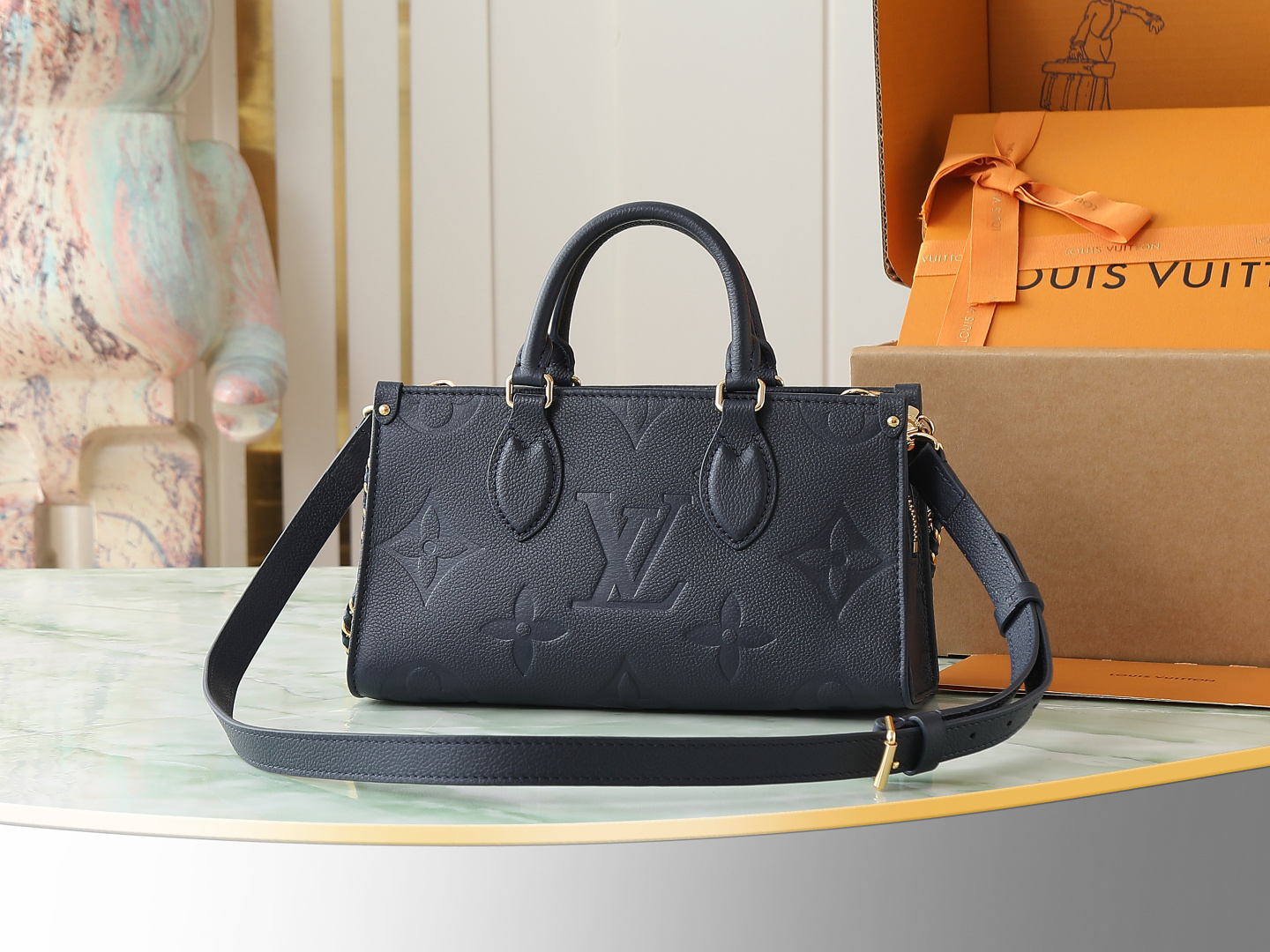 Louis Vuitton M23640 Deep Blue Embossed: This small OnTheGo handbag is crafted from Monogram Empreinte leather, embossed with the Giant Monogram pattern.